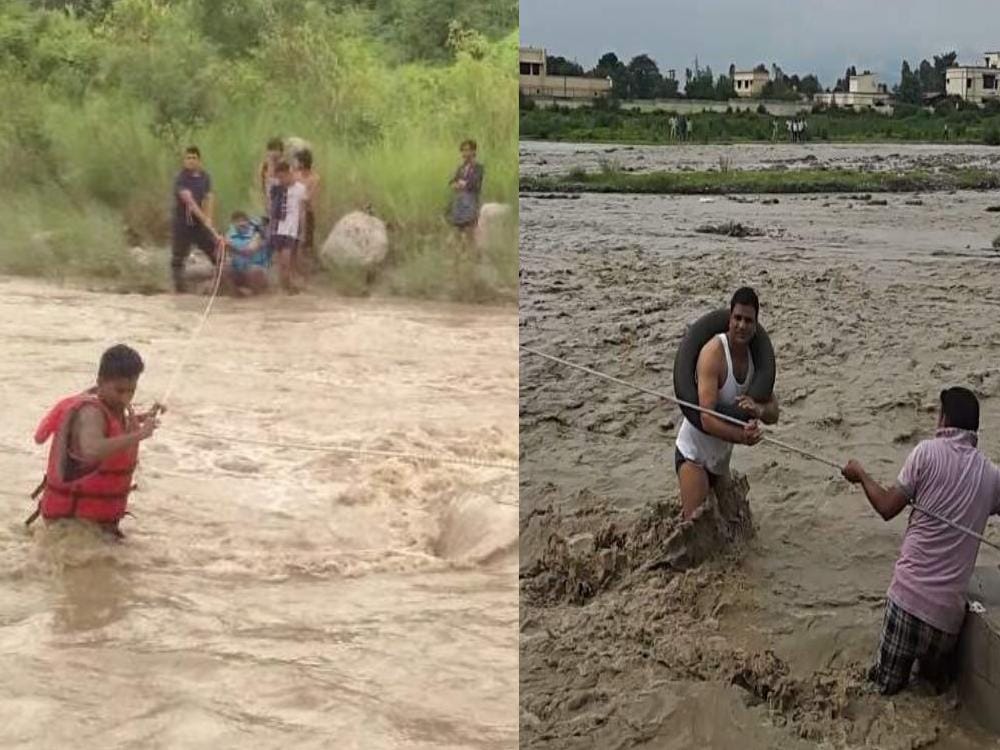 tourist stuck in river flow in dehradun