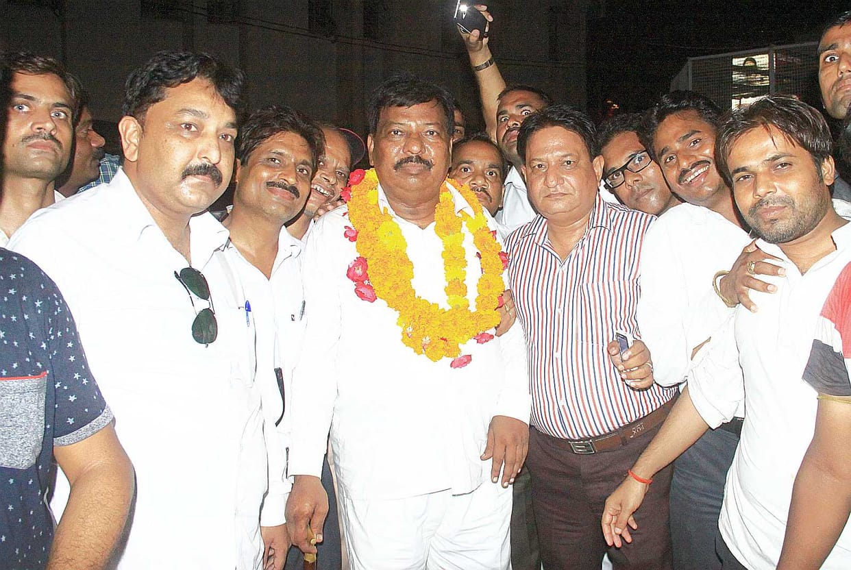 MP Singh, won 13 votes in a tight race