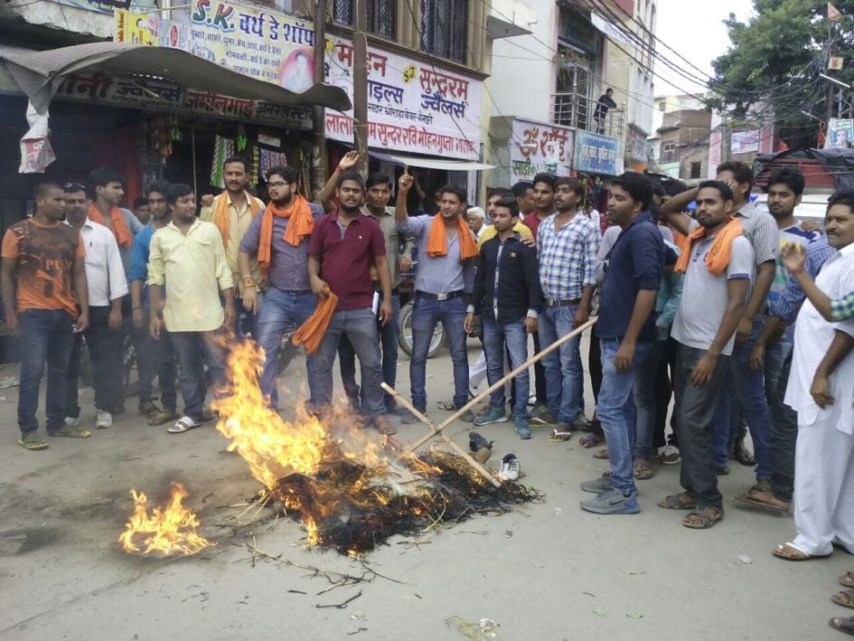 Azam burned effigies of the BJP and Hindu Vahini