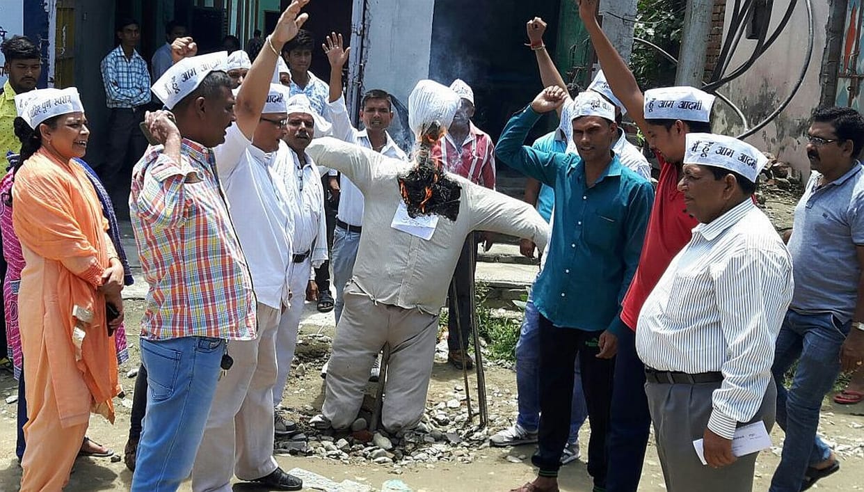 Burnt effigies of Chief Minister.