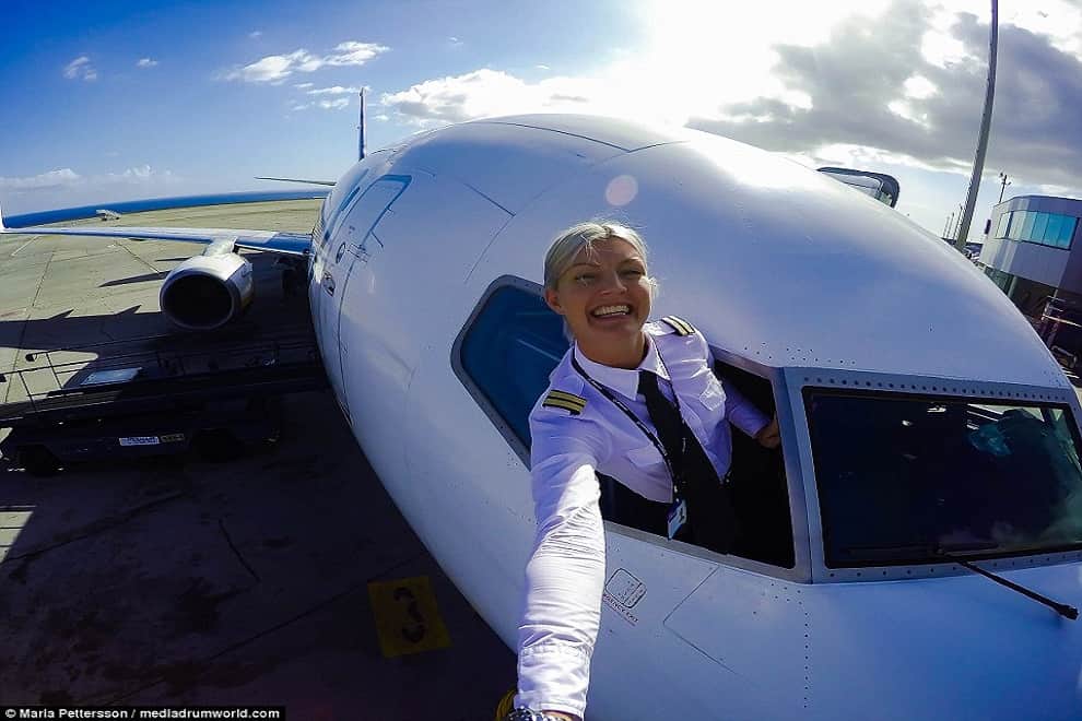 glamorous pilot takes selfies 