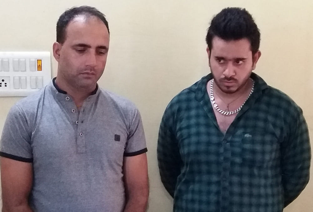two arrested with 56 golden coins