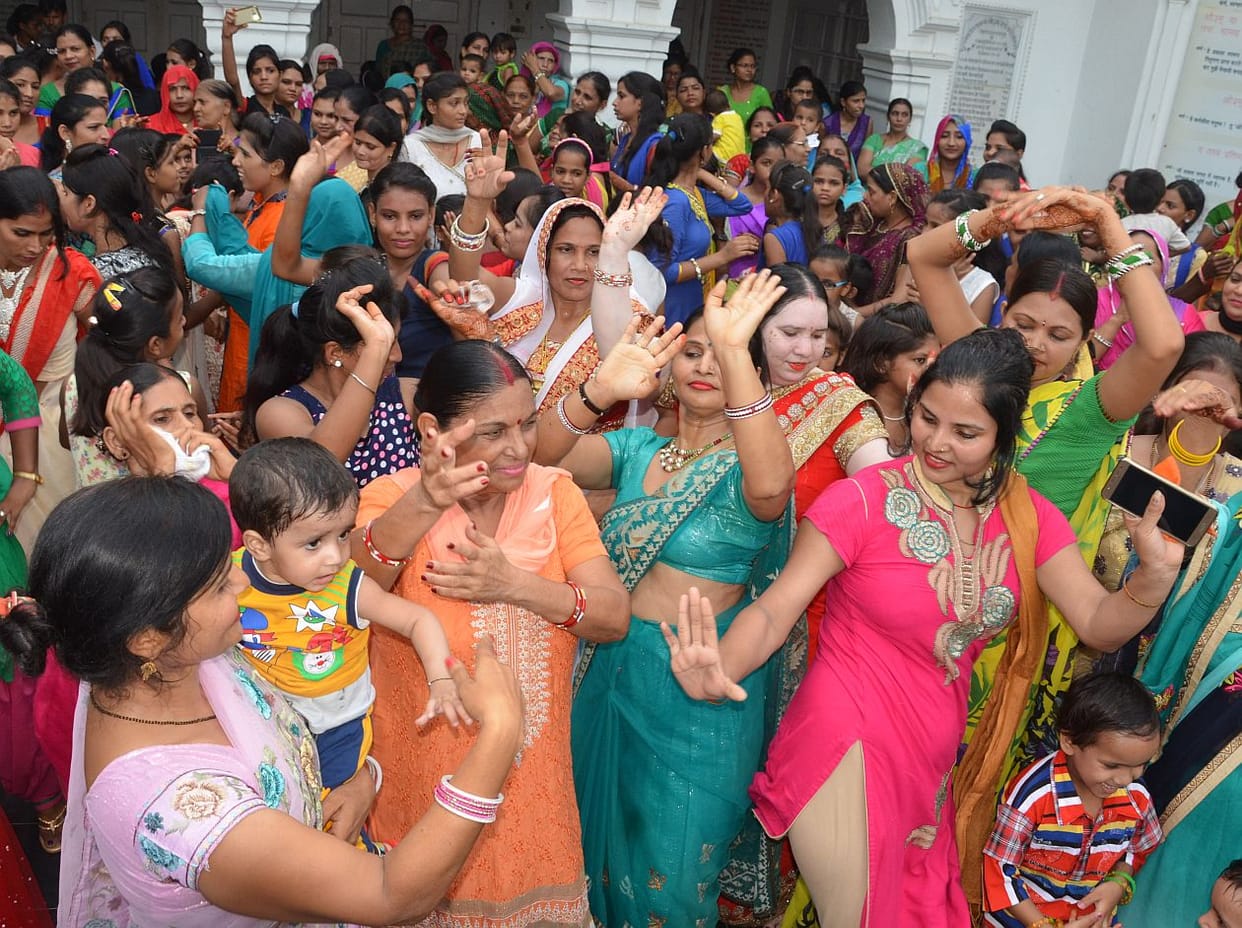 Sawan women twirled songs.