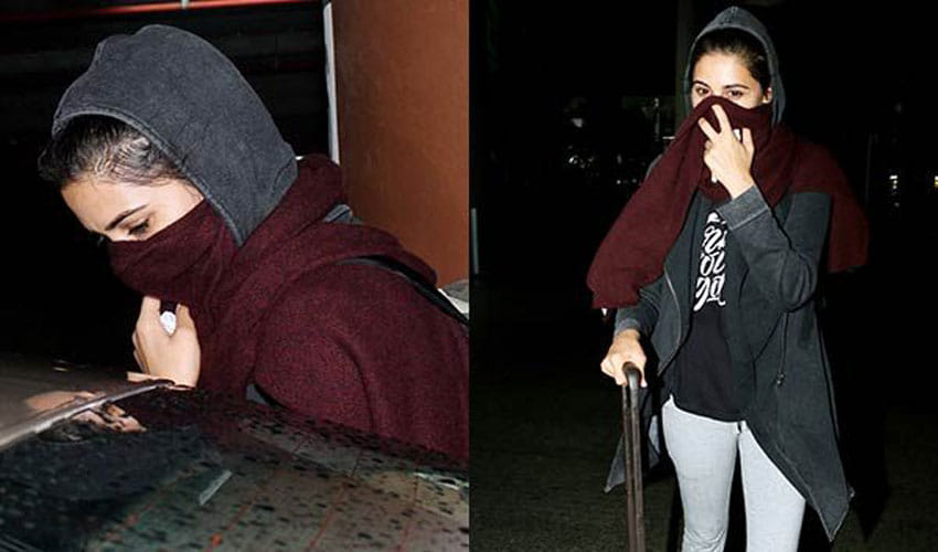 this herione was seen in mumbai airport hiding her face