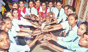 Arabian and bridal henna decorated hands on Teej