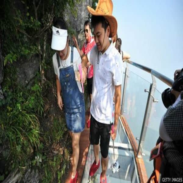 Don't look down: Glass walkway hugs mountain in China
