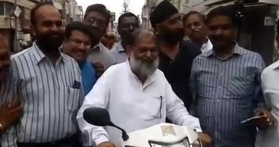 bjp minister anil vij break traffic rules by driving activa without helmet in ambala