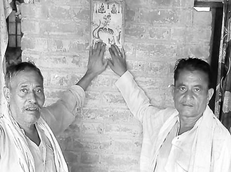 Pictures of the serpent god pasted outside houses