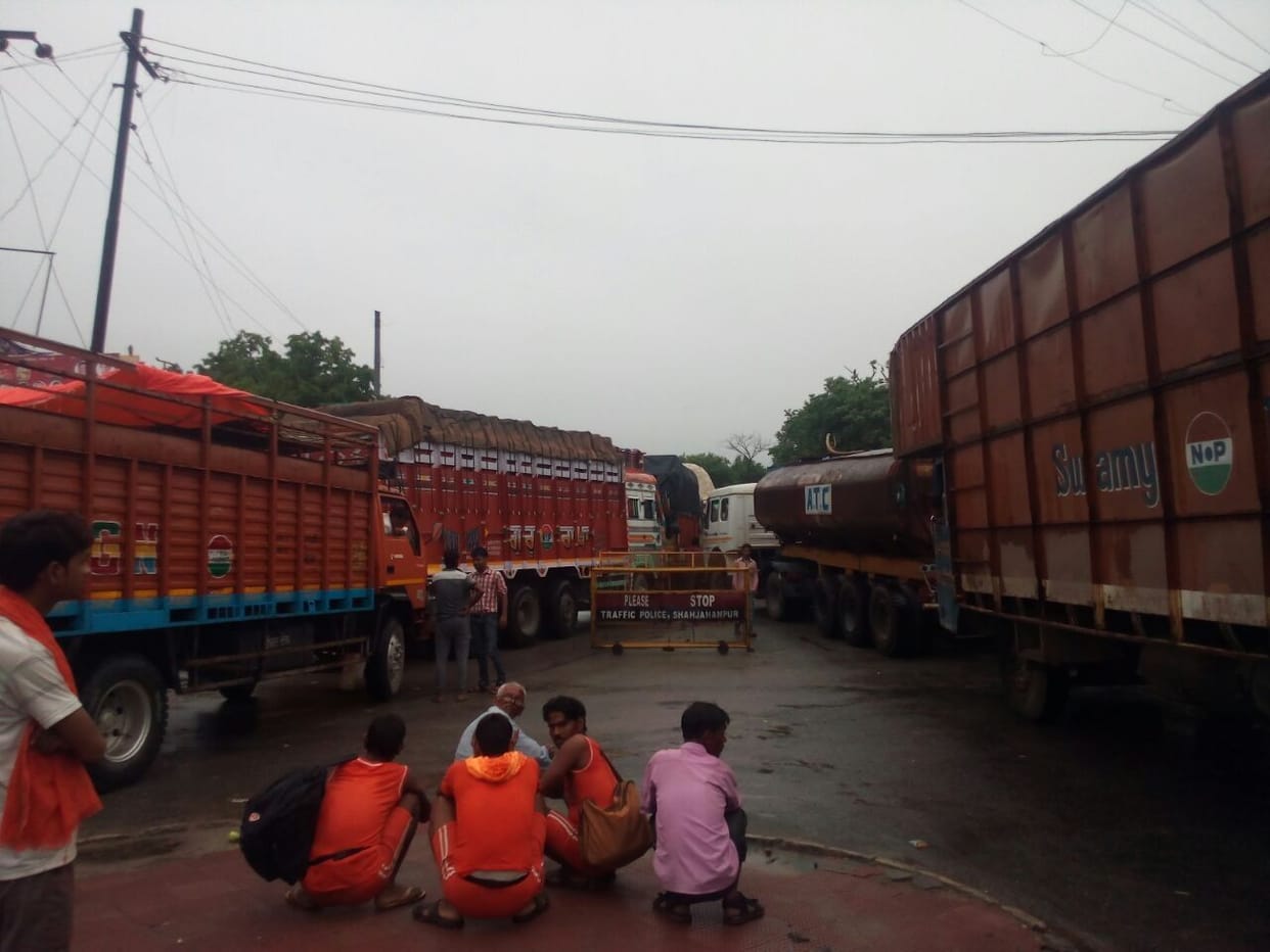 Truck stuck in the mud, putting jam on highway