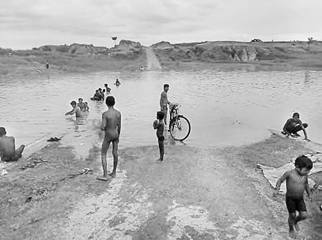 The Yamuna river rising, four villages cut-off