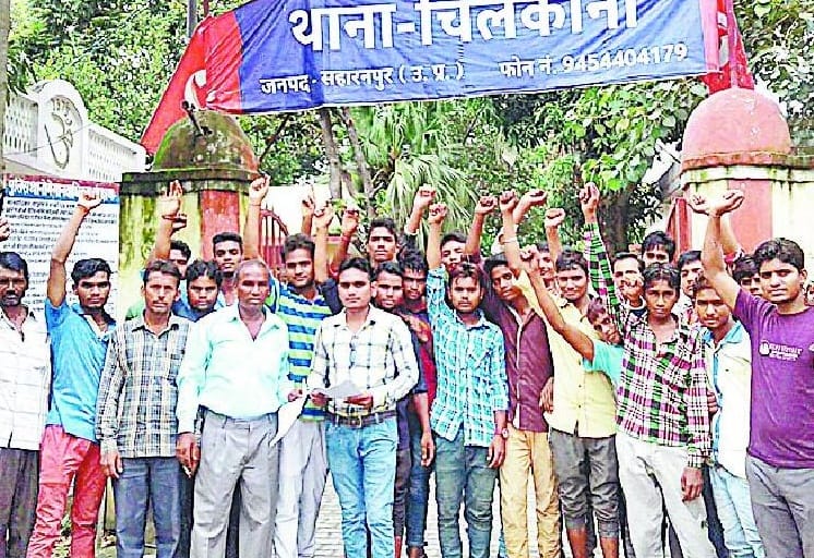 Dalits protest at police station 