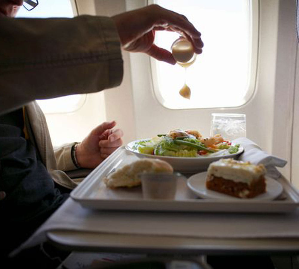 you should avoid this foods before getting on a plane