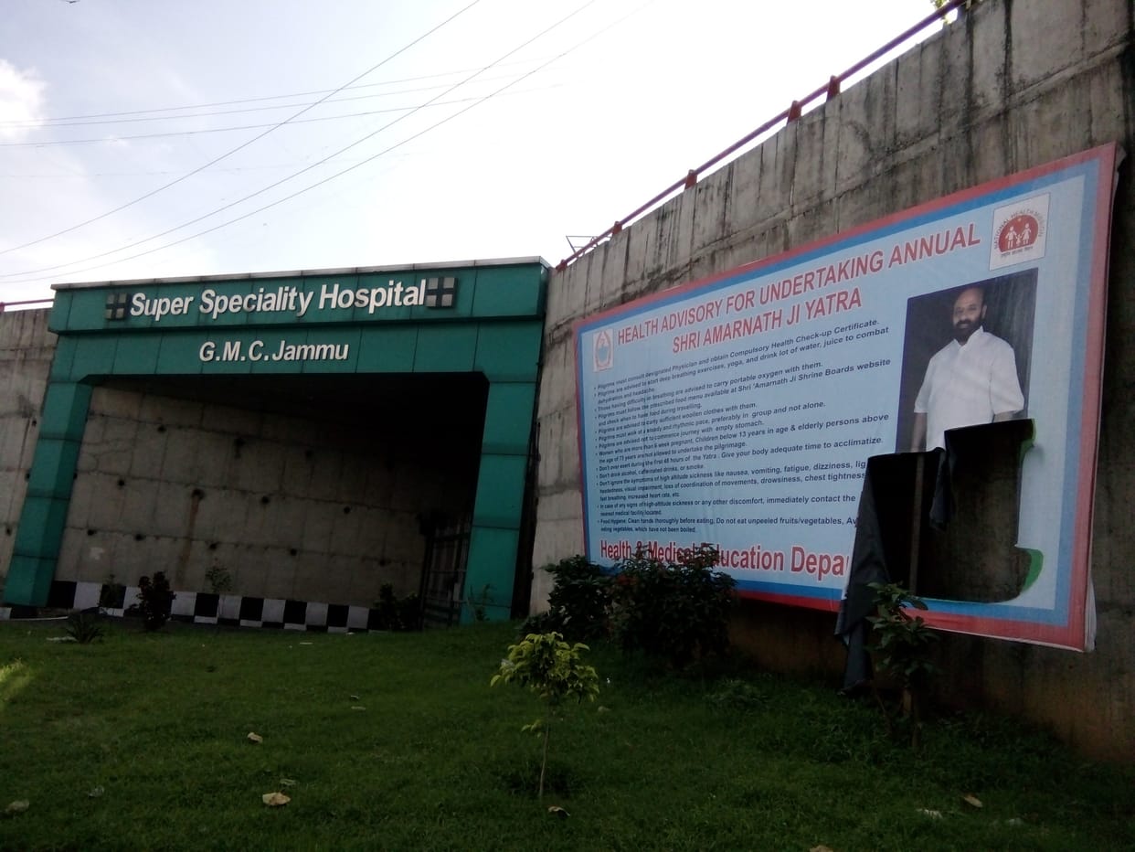 torn posters of health minister