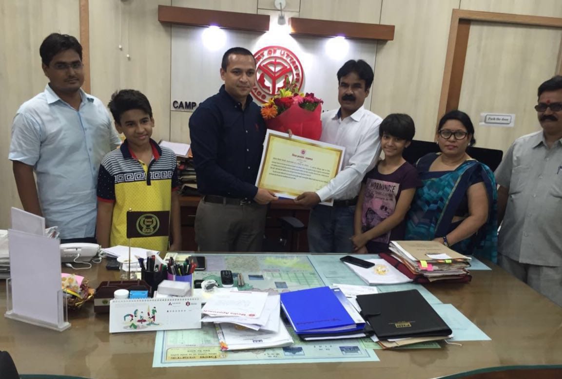  businessman kaushal honored by dm rajshekhar