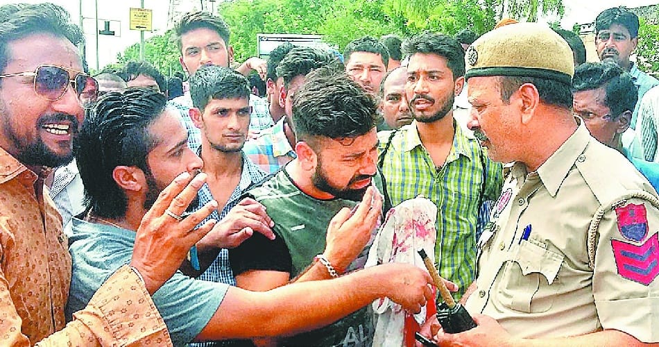  policeman hit boy riding without helmet, public protest against mohali police