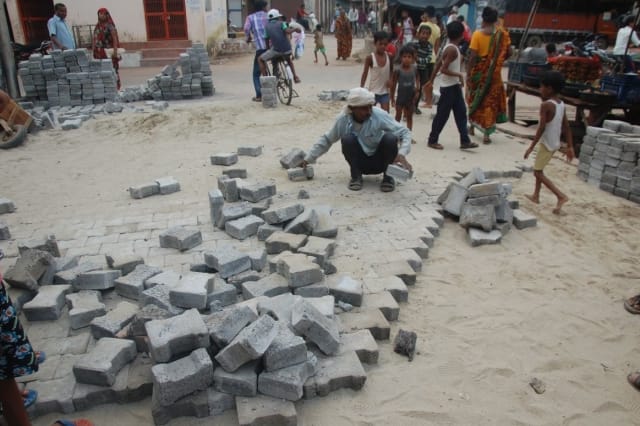 Bricks were thrown out by the erupted people on inferior construction