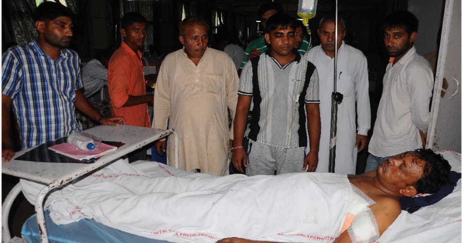 frantically firing on The Sarpanch and his son