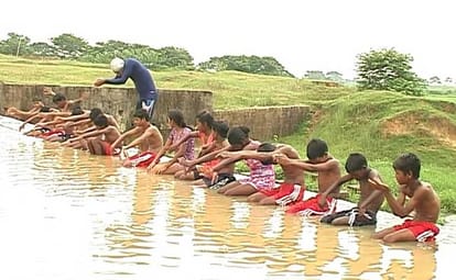 Aspiring Swimmers Preparing In A Dam For 2020 Olympics