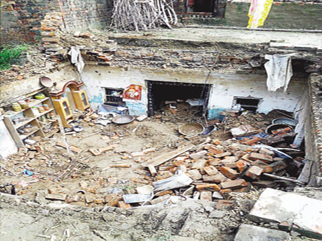 Pucca houses and the wall collapsed, including two women killed