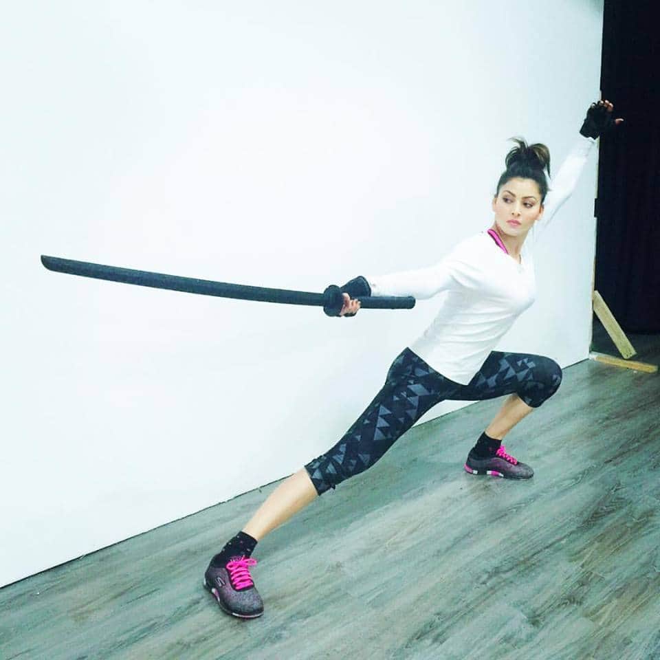 bollywood actress urvashi rautela in sword fighter look.