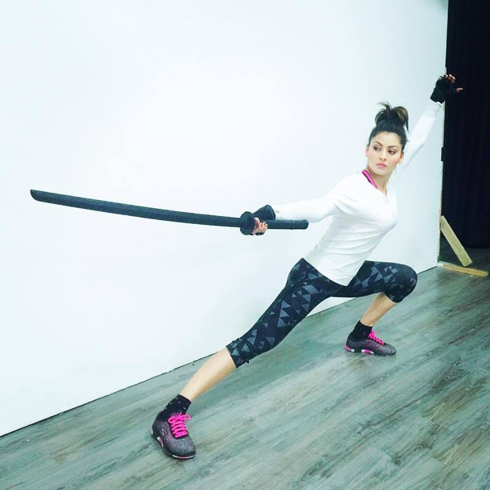 bollywood actress urvashi rautela in sword fighter look.