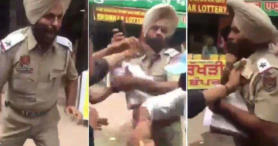 on duty asi brutally beaten on road by boys, video viral on social media