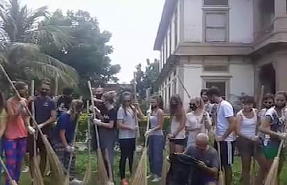 Italy student team cleaning the temple complex