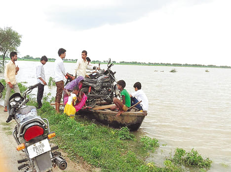 Brothers, including car dealer in flood flow
