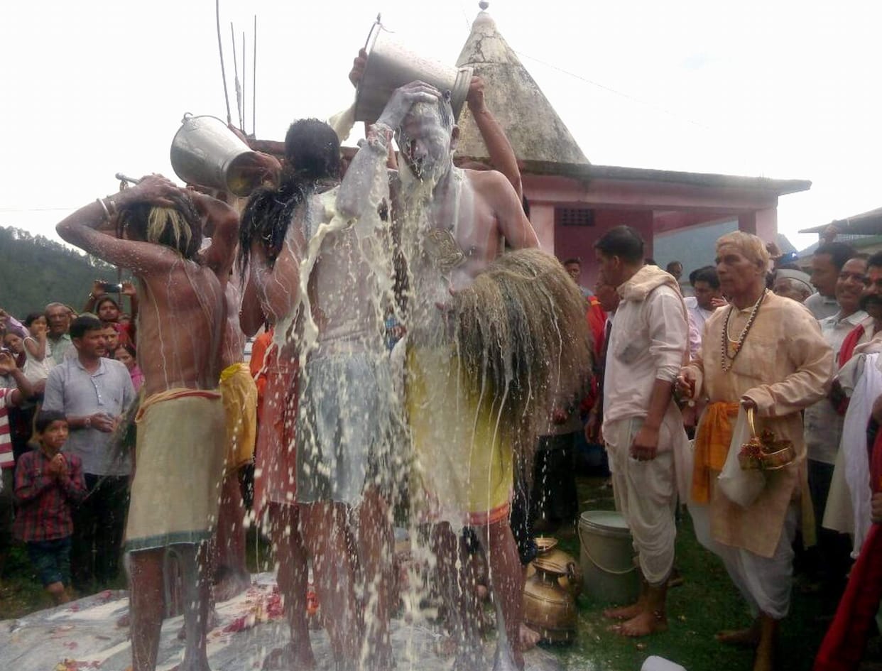 Villagers dance with Dev Dolion