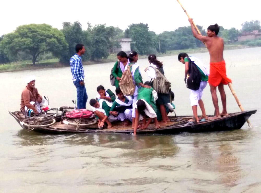 Upturned boat full of school children in Rapti