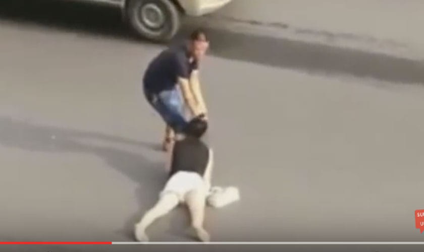video shows woman dragged by HAIR across road in china