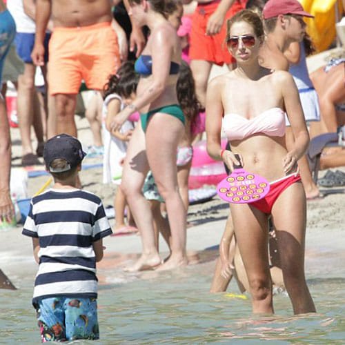 stacey solomon adjust her bikini in the beach