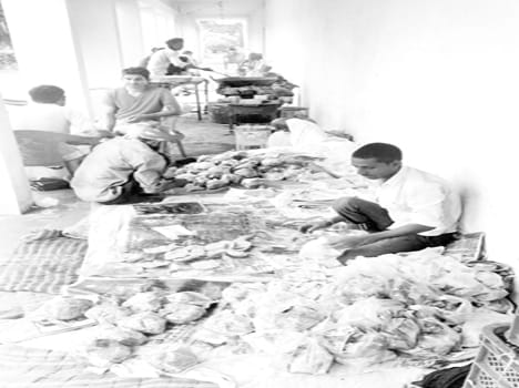 Delivering lunch to flood victims in polythene packets