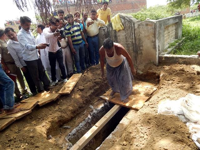 The autopsy of the woman's body out of the grave