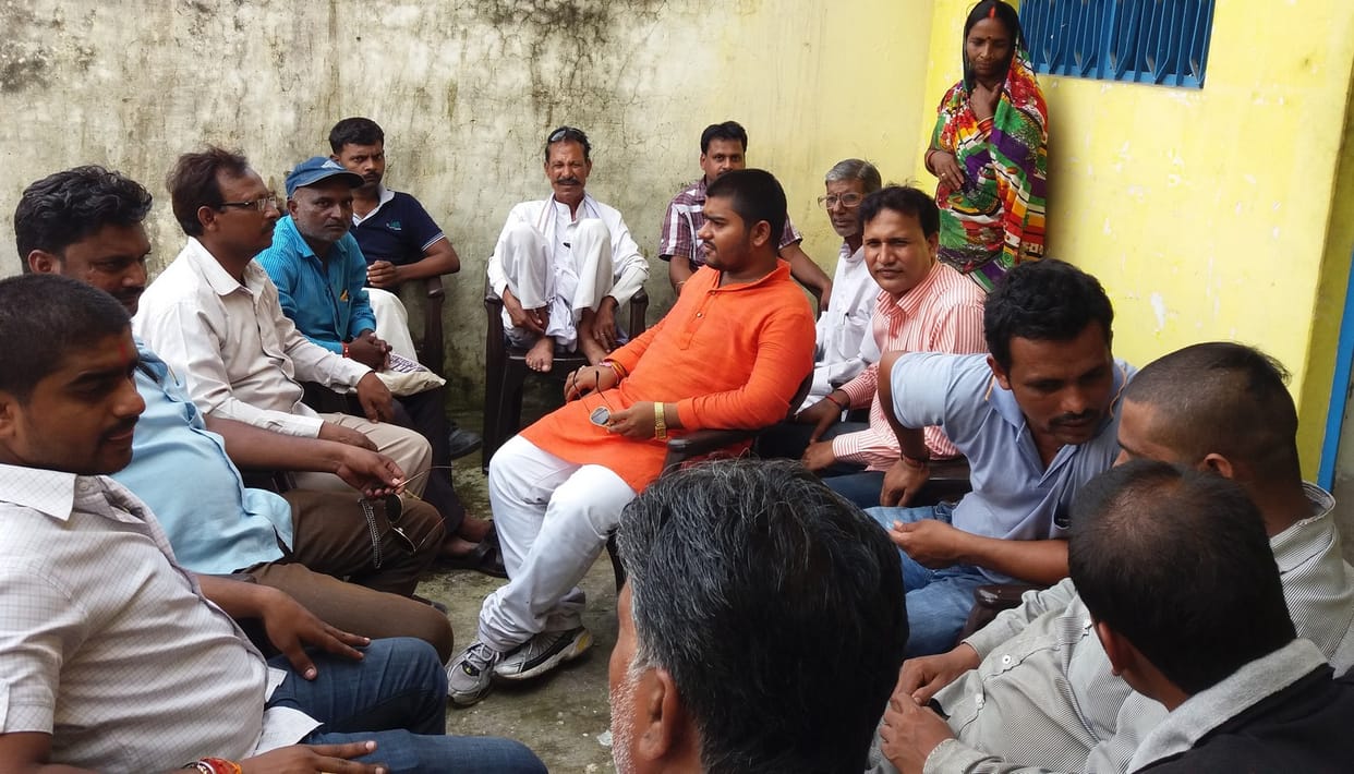 Staple grain and distributed it in the presence of members