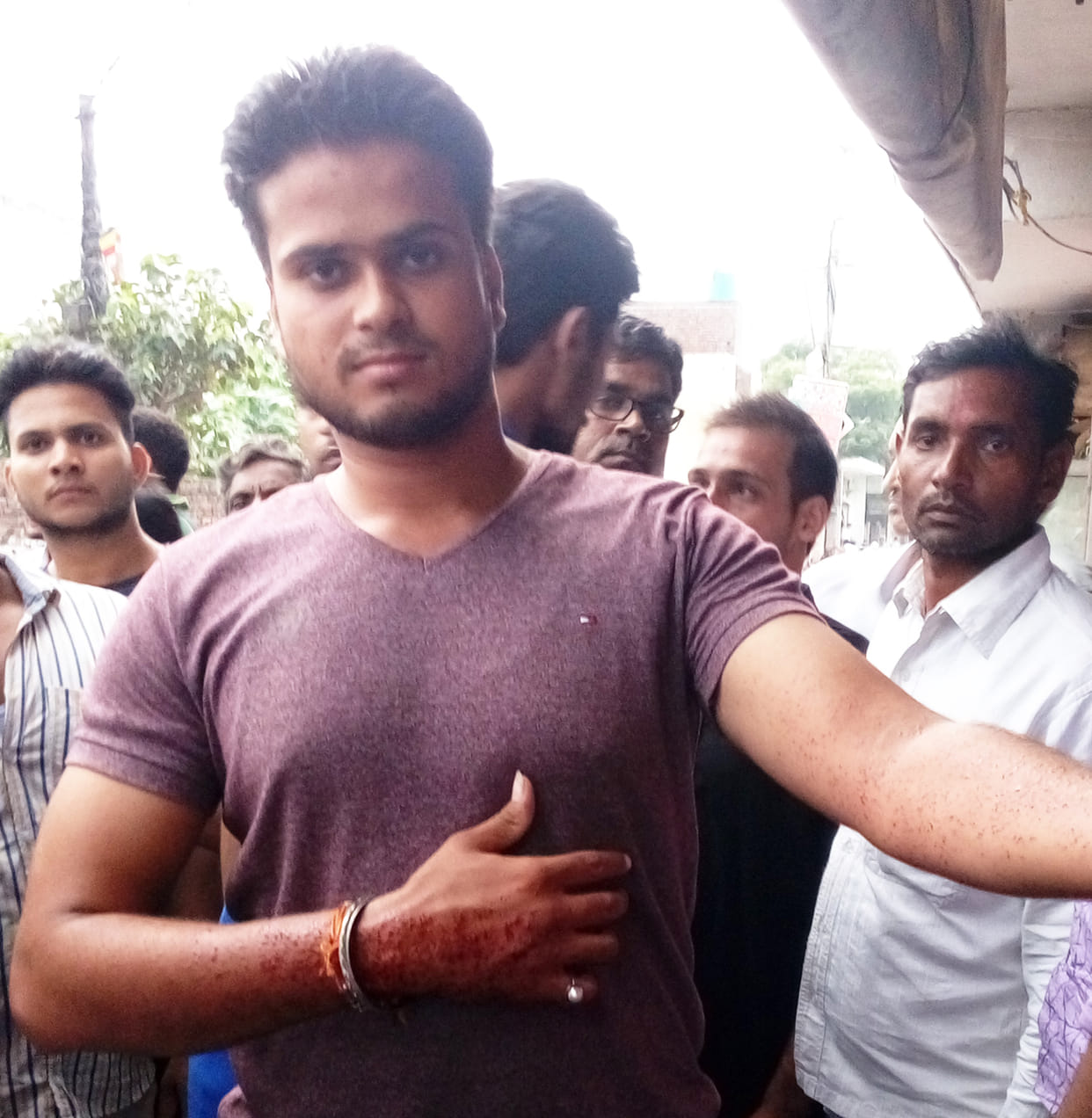 Standing outside the house fired on youths.