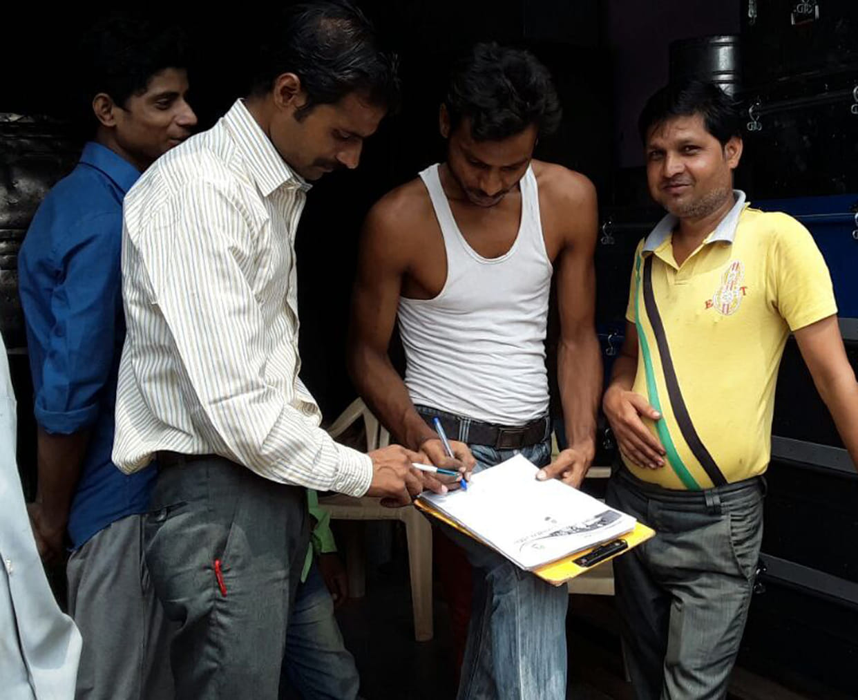 People sign to protest the four-lane