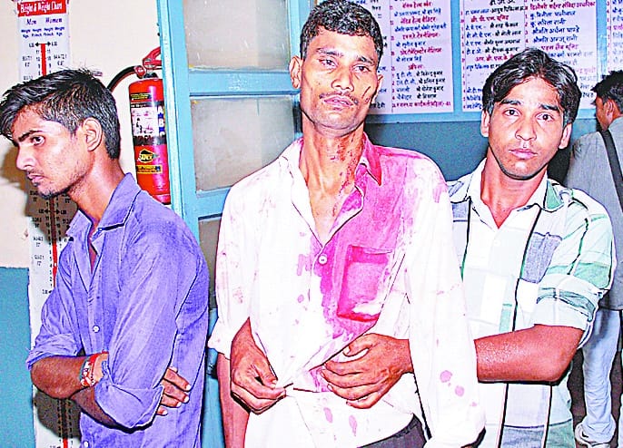  struggle against imposing gate, 14 injured