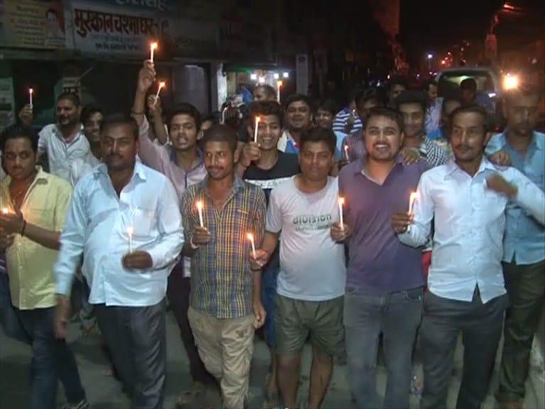 candle march against electriccut