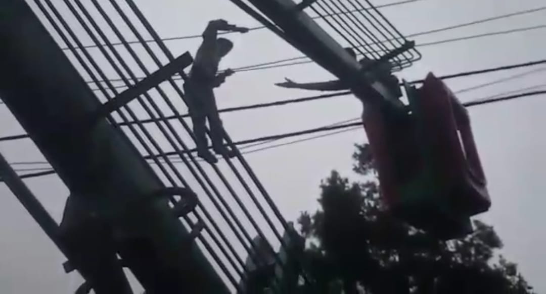 Mentally disturbed young man climb on electricity pole