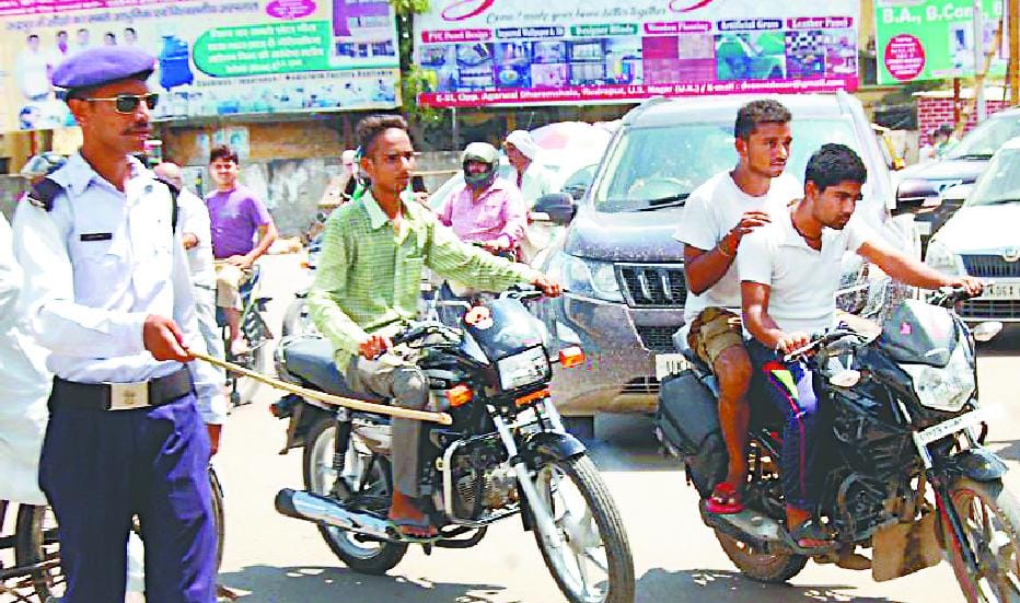 Dodging the police are only driver without a helmet