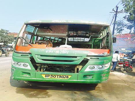 The students threw stones at the bus