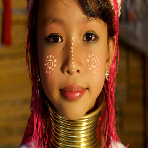kayan tribe women wear multiple rings all around