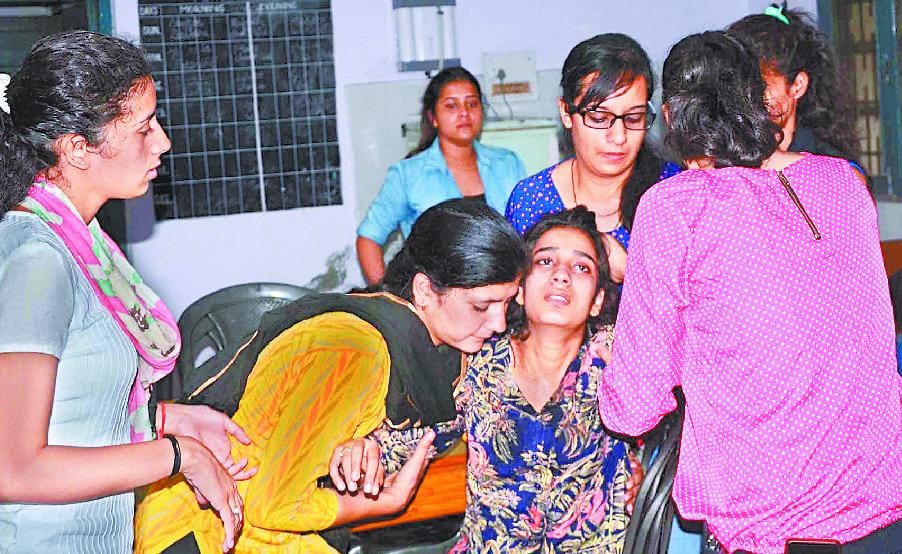 girl student weeping after girl sucide