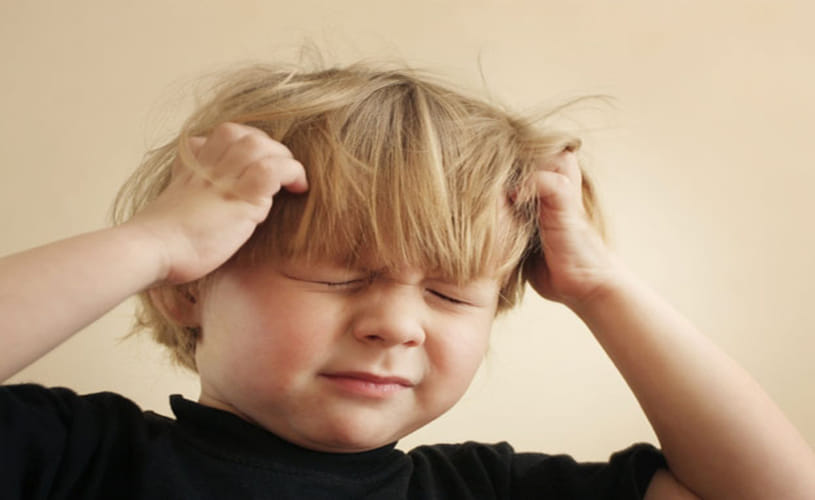 beating behind the head of a child