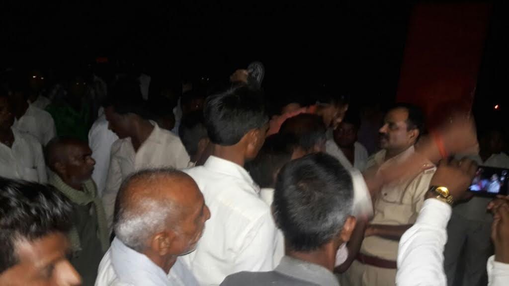 People surrounded the police station late at night