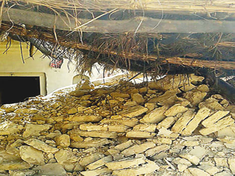 The roof collapsed, buried in the rubble woman