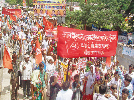 Red flags and carrying banners demanding the right of workers
