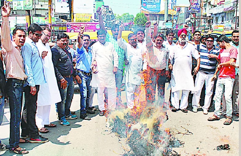 Burnt effigies of the GST bill