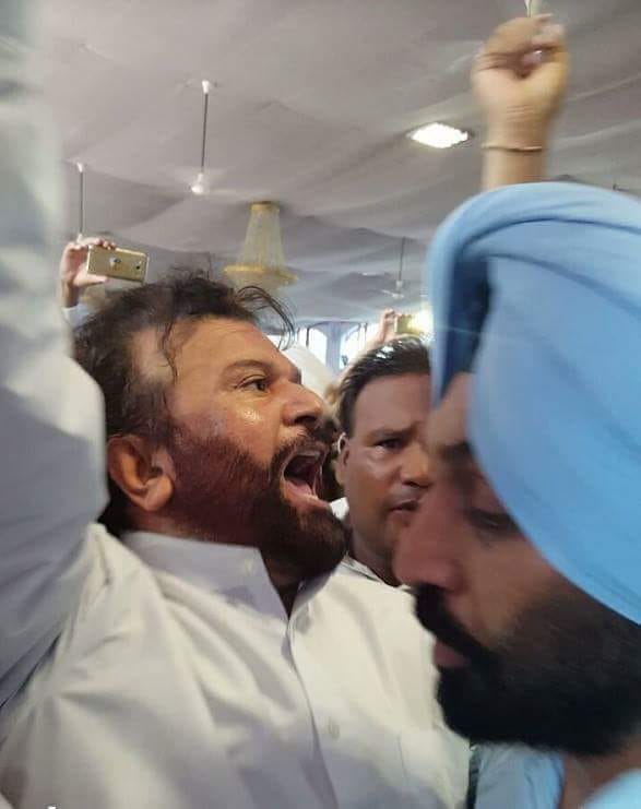 High voltage drama in Congress meeting, hans raj hans jumped down from the stage
